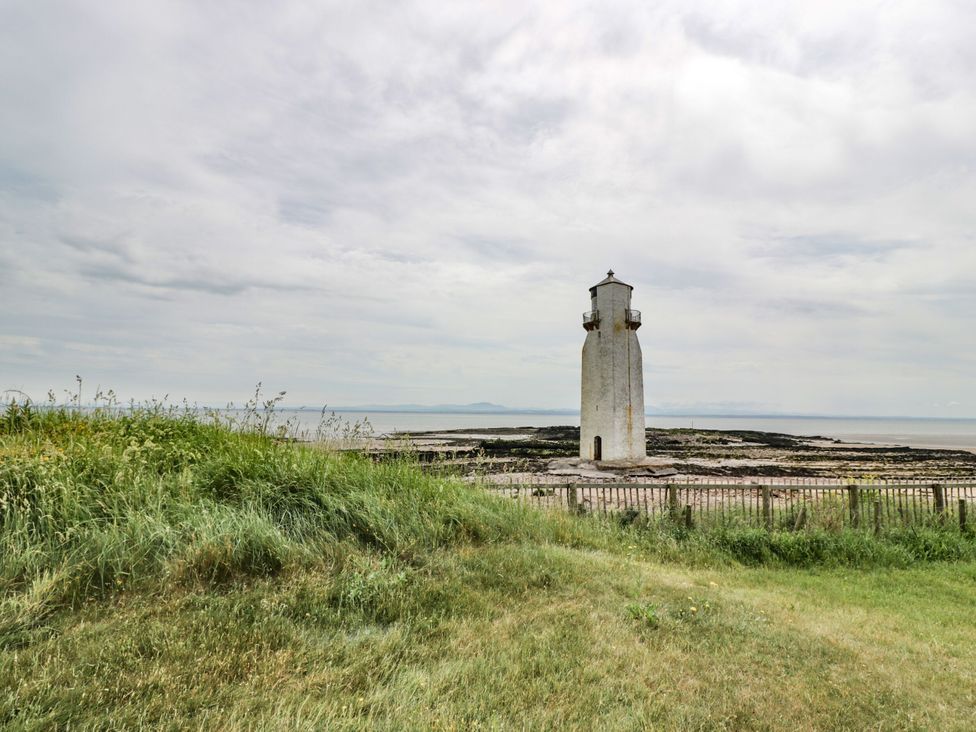A lighthouse by the sea at Wagtail Cottage in Southerness