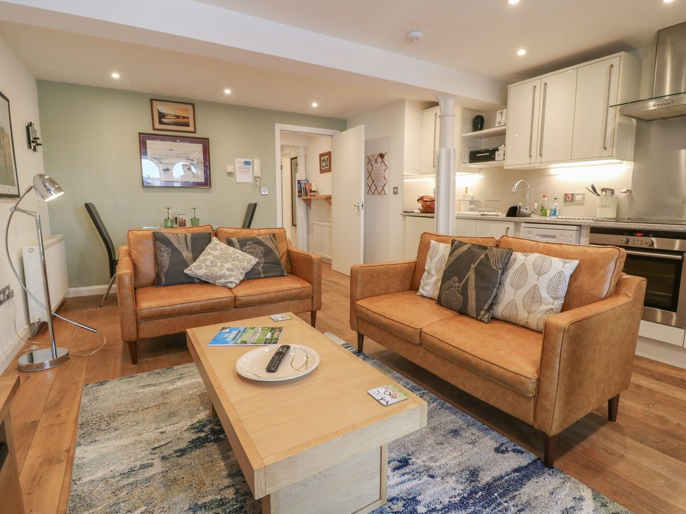 A living room with two sofas and a coffee table at Mill Wharf in Berwick-upon-Tweed
