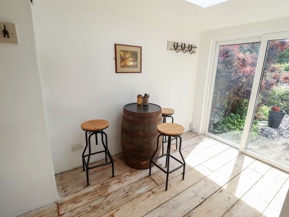A snug with a barrel table and stools at 3 Rectory Row