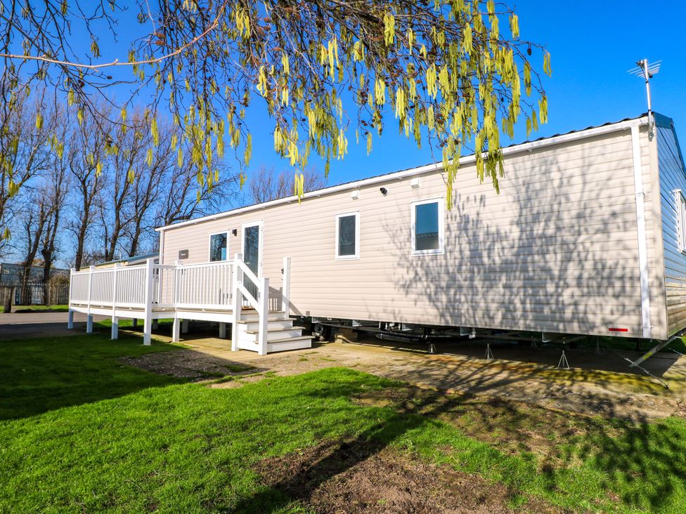 A mobile home with a deck and stairs at 0028 South Beach