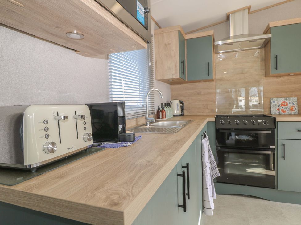 A kitchen with appliances and cabinetry at 0028 South Beach