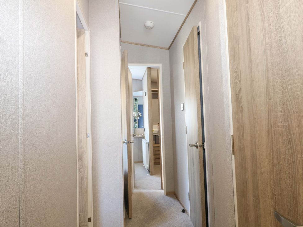 A hallway with doors on either side at 0028 South Beach
