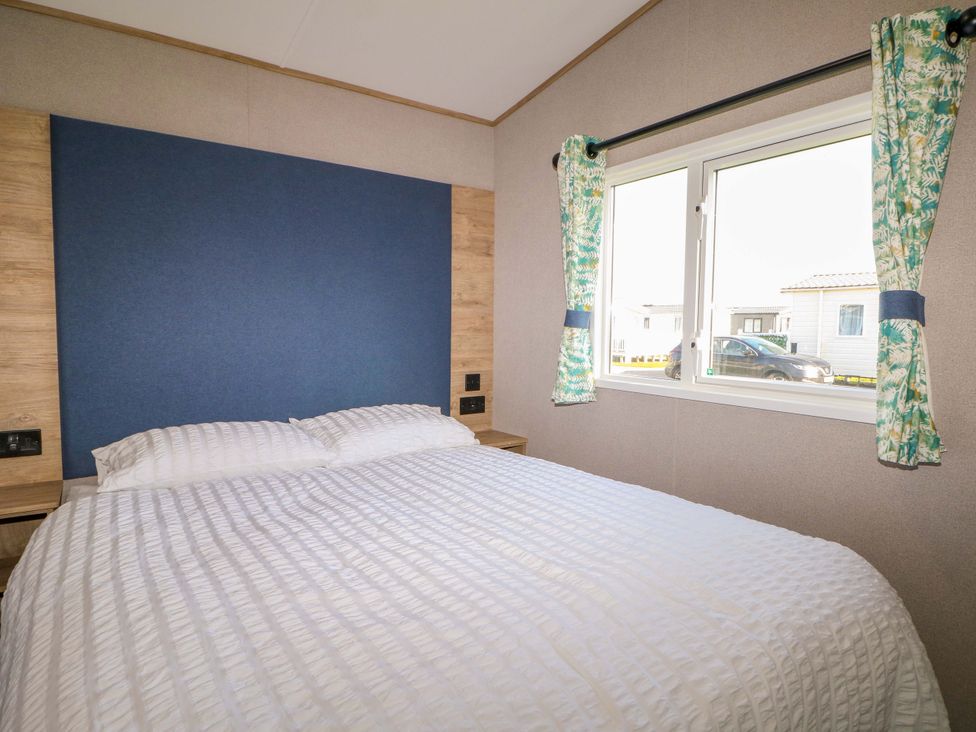 A bedroom with a bed and window at 0028 South Beach