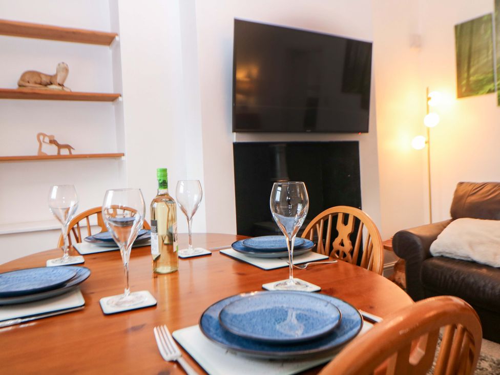 A dining table set with plates and glasses at Nature’s Retreat in Matlock