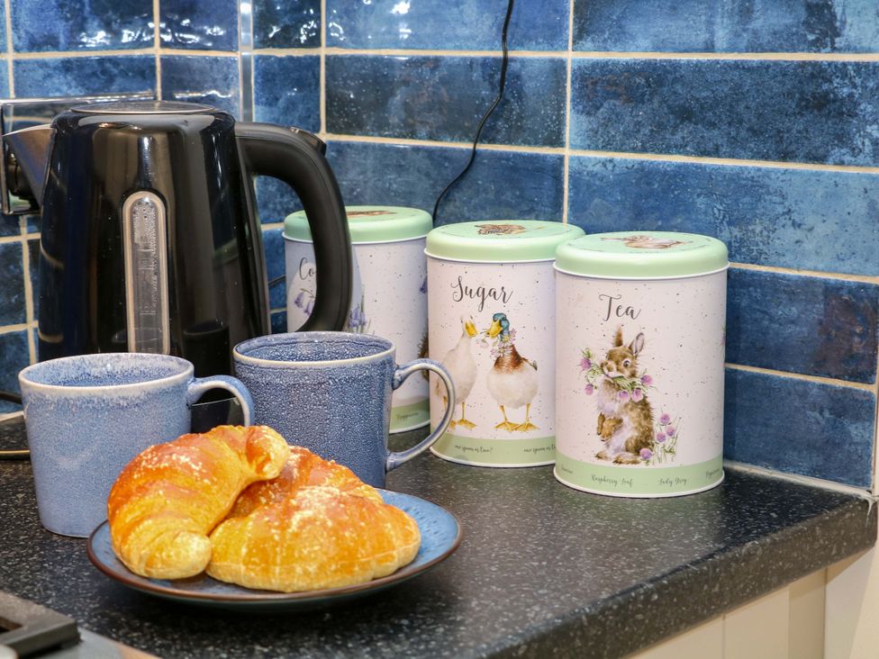A kettle and containers on a kitchen counter at Nature’s Retreat Matlock