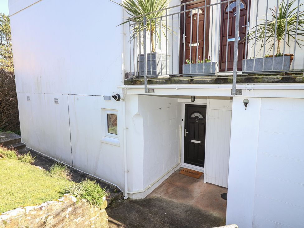 An entrance area with doors and plants at 3 The Elms in Salcombe