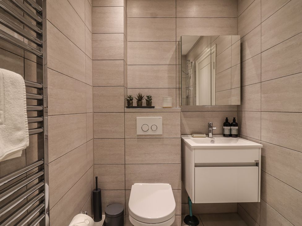 A bathroom with a sink and toilet at 3 The Elms Salcombe