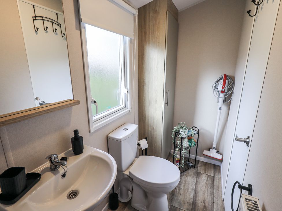 A bathroom with a sink and toilet at Hadrian's Rest in Wigton