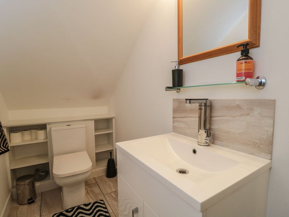 A bathroom with a wash basin and toilet at The Nest in Meare near Glastonbury