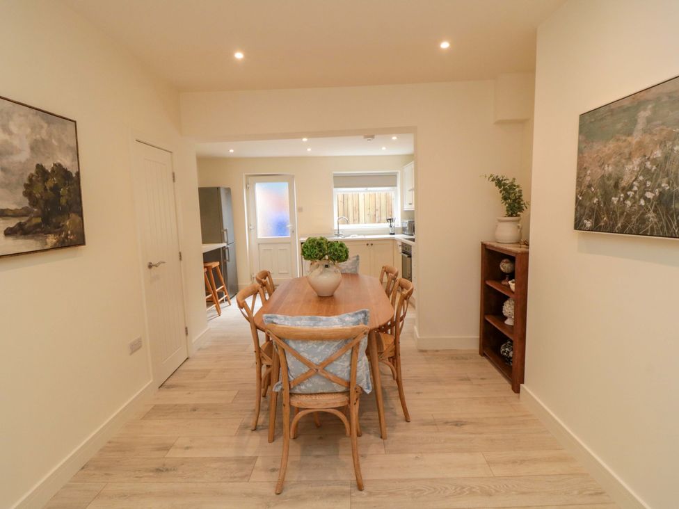A dining room with a table and chairs at No.9 Trafalgar St West in Scarborough