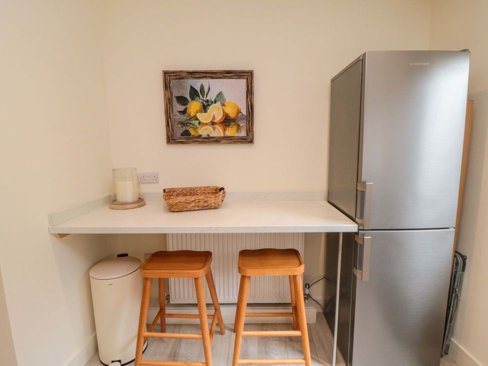 A kitchen with a countertop and bar stools at No.9 Trafalgar St West Scarborough
