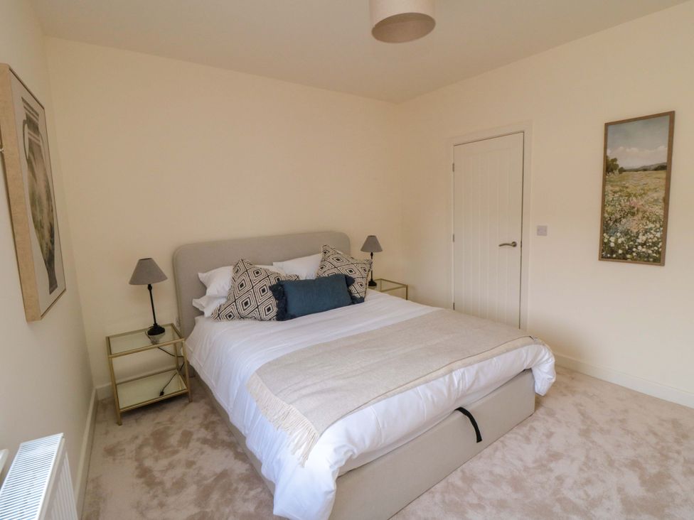 A bedroom with a bed and bedside table at No.9 Trafalgar St West in Scarborough
