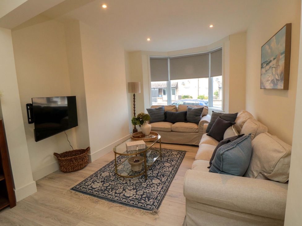 A living room with a sofa and a coffee table at No.8 Trafalgar St West Scarborough