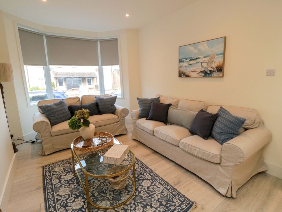 A living room with sofas and a coffee table at No.8 Trafalgar St West in Scarborough