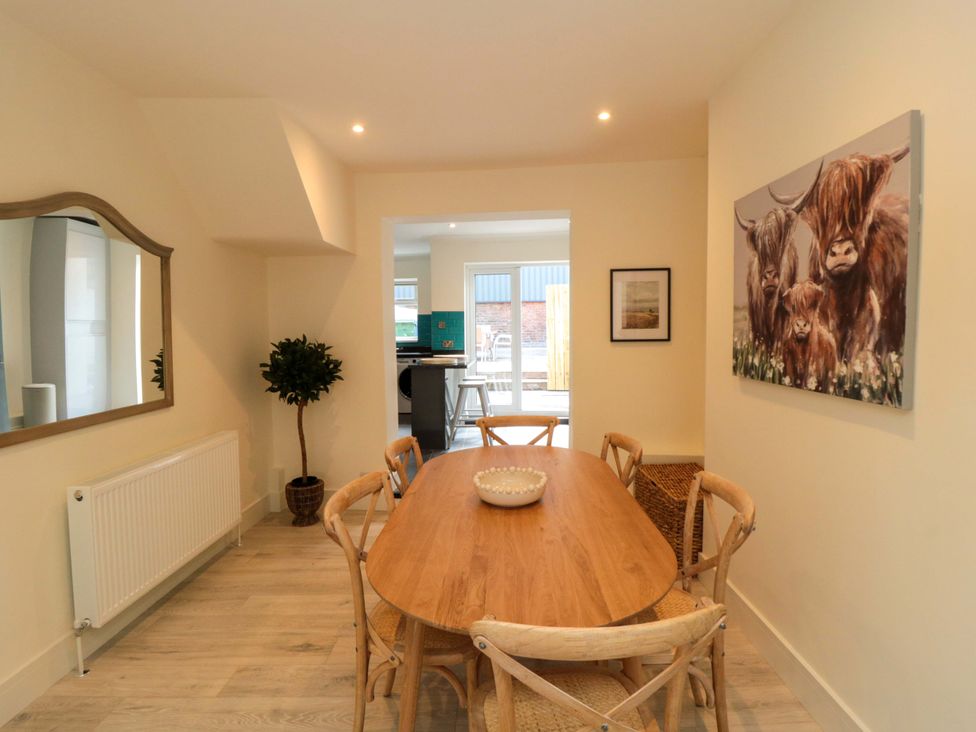 A dining room with a table and chairs at No.8 Trafalgar St West Scarborough
