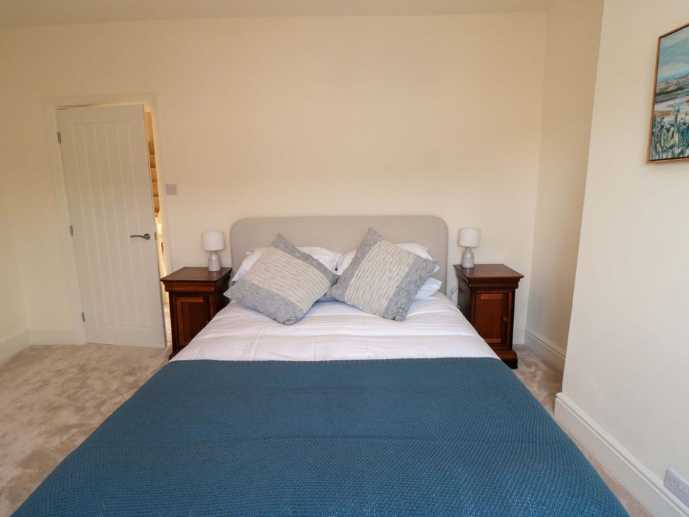 A bedroom featuring a bed with pillows and nightstands at No.8 Trafalgar St West Scarborough