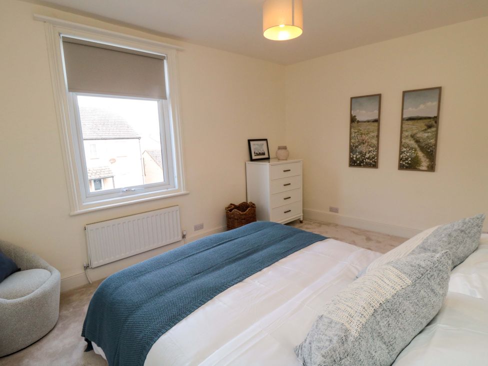 A bedroom with a bed and a dresser at No.8 Trafalgar St West in Scarborough