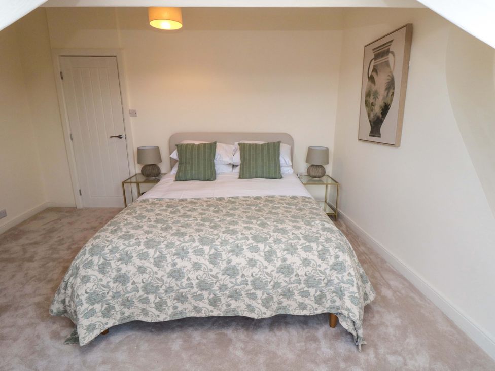 A bedroom with a bed and nightstand at No.8 Trafalgar St West Scarborough