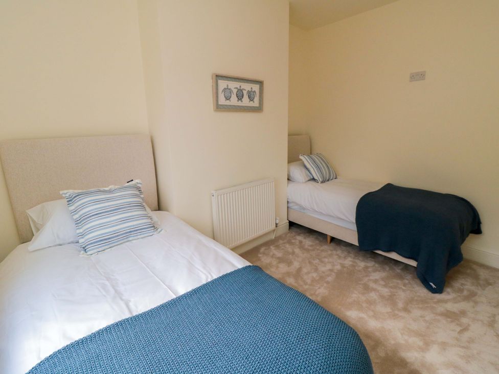 A bedroom with two beds at No.8 Trafalgar St West in Scarborough