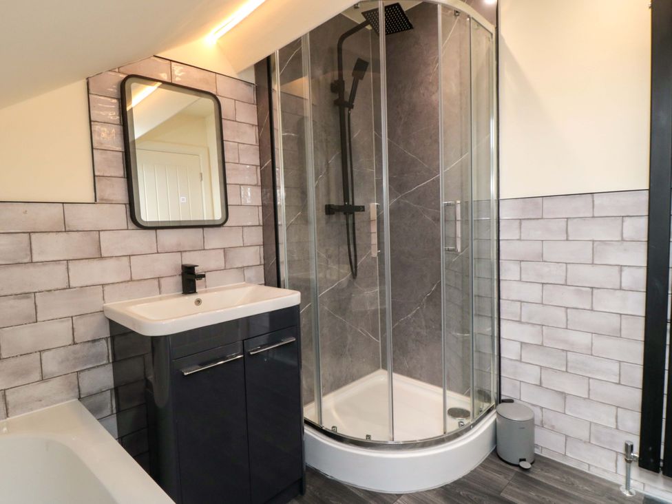 A bathroom with a shower and sink at No.8 Trafalgar St West Scarborough