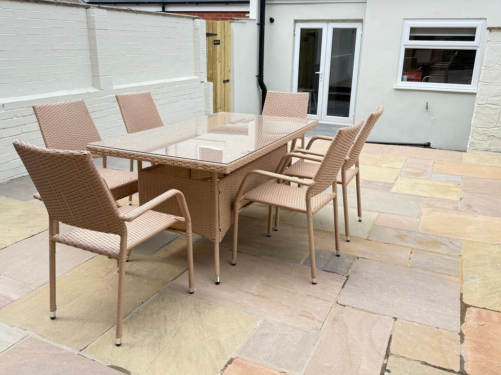 A patio with a table and chairs at Trafalgar I in Scarborough