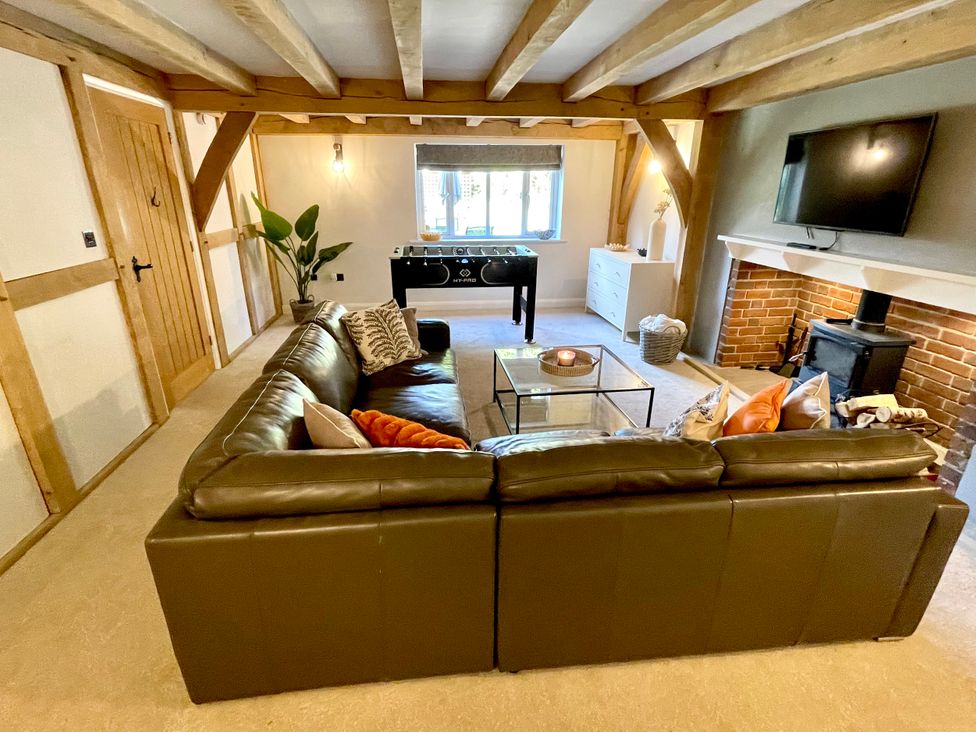 A living room with a sofa and coffee table at The Oaks in Great Harwood