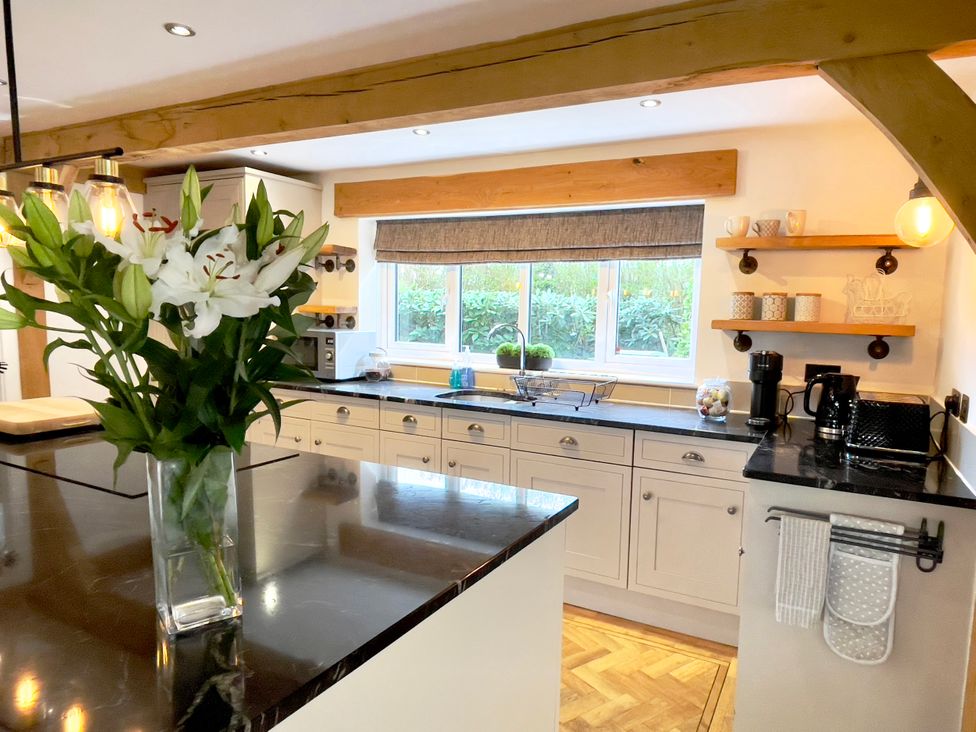 A kitchen with a sink and counter at The Oaks in Great Harwood