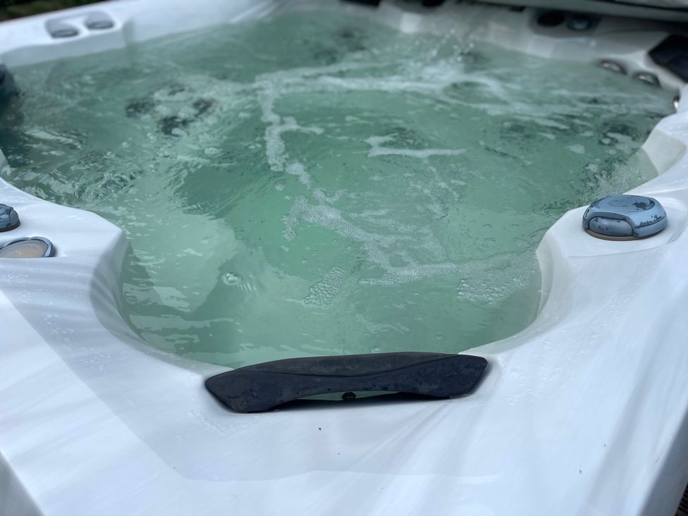 A hot tub with water and jets at The Oaks in Great Harwood