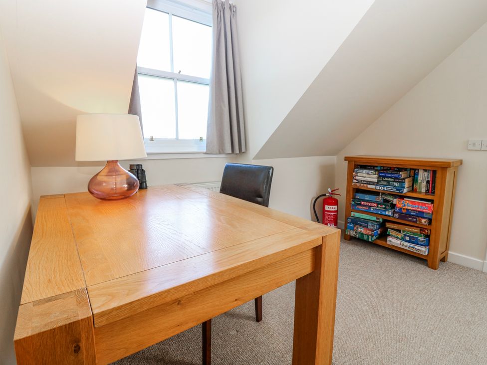An office with a table and chair at Meadowgreen Farmhouse in Forfar