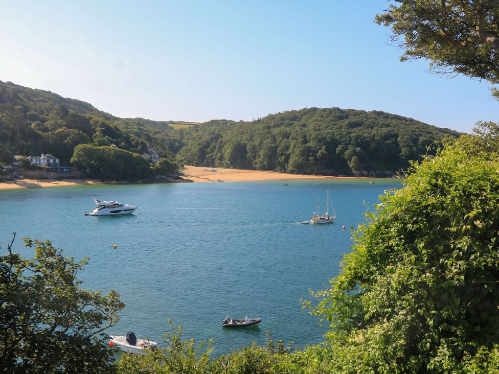A view of water with boats and hills at 4 The Elms Salcombe