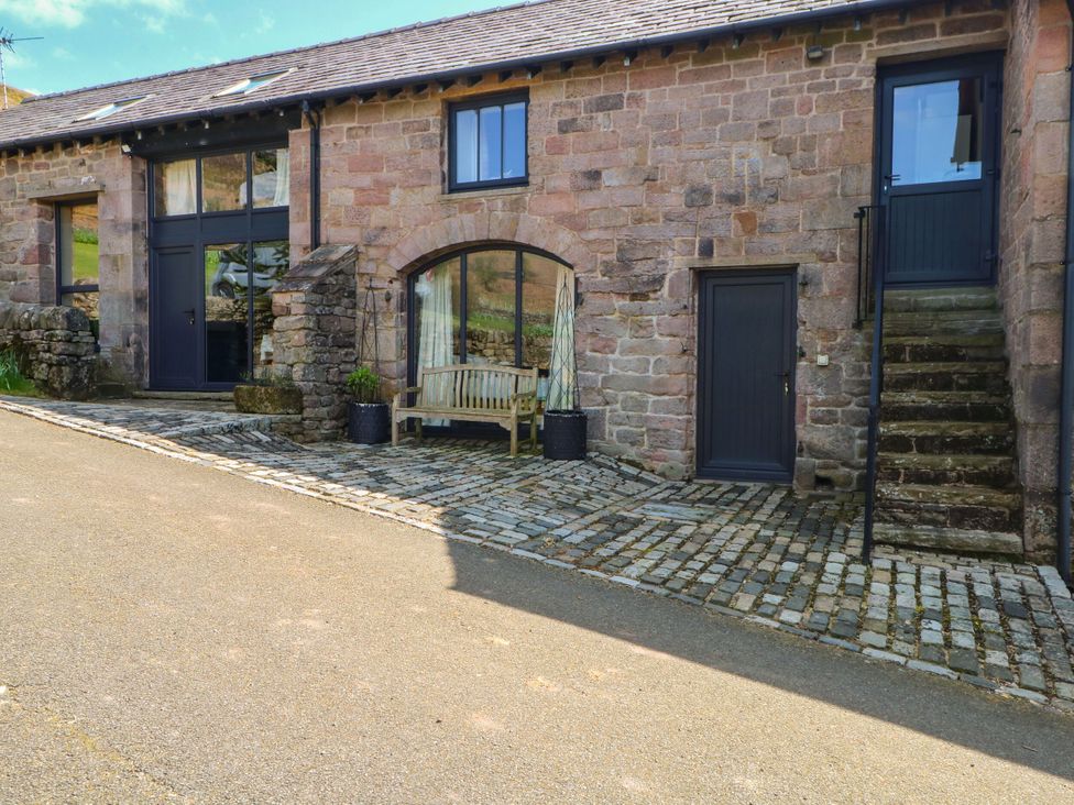 An outdoor area with steps and a bench at Pearls Farm One Wildboarclough near Macclesfield
