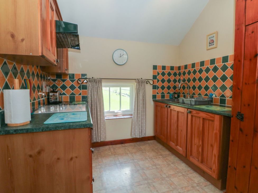 A kitchen with a sink and cabinets at Pearls Farm One Wildboarclough near Macclesfield