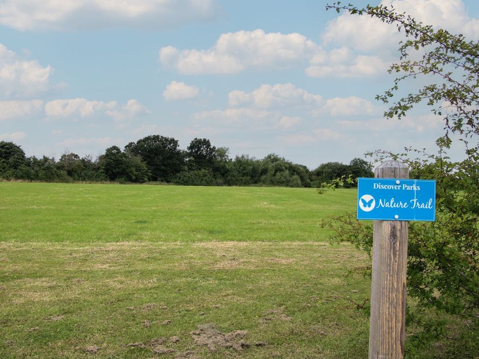 A nature trail sign in a grassy area at Tulip in Eardisland