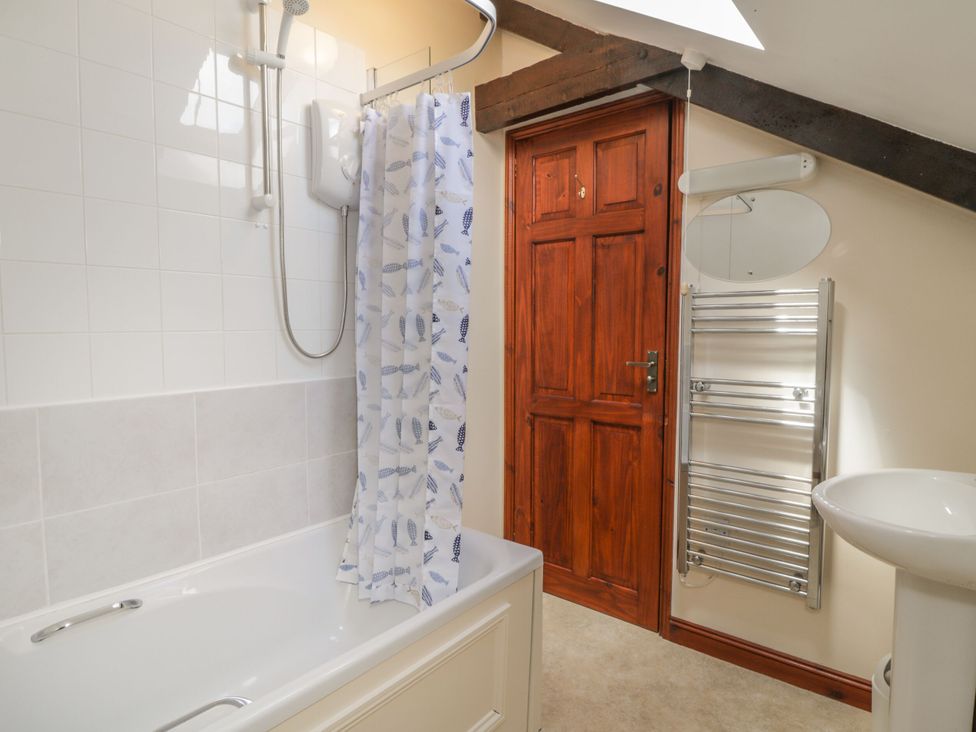 A bathroom with a shower and bath at Applestore in Wadebridge