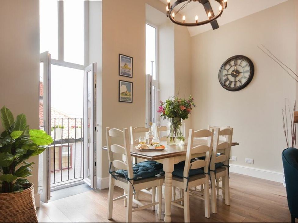 A dining room with a table and chairs at Juniper Cottage