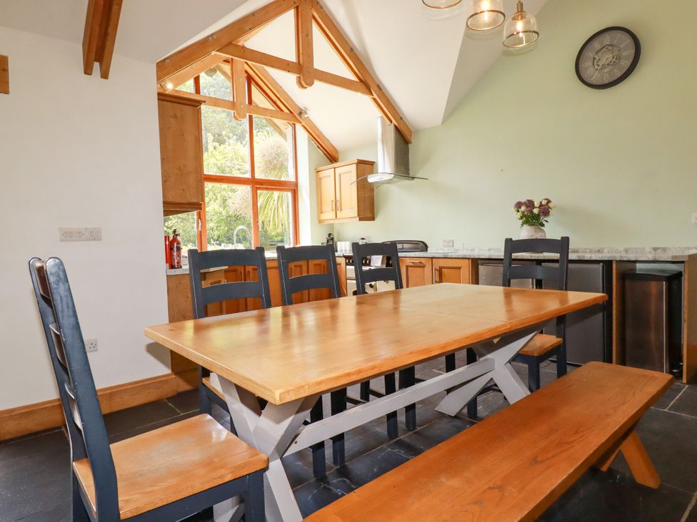 A dining room with a table and chairs at Little Trethellan near Lanner