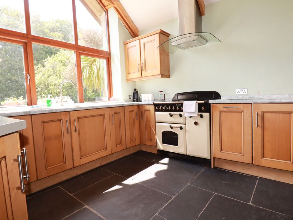 A kitchen with cabinets and an oven at Little Trethellan near Lanner