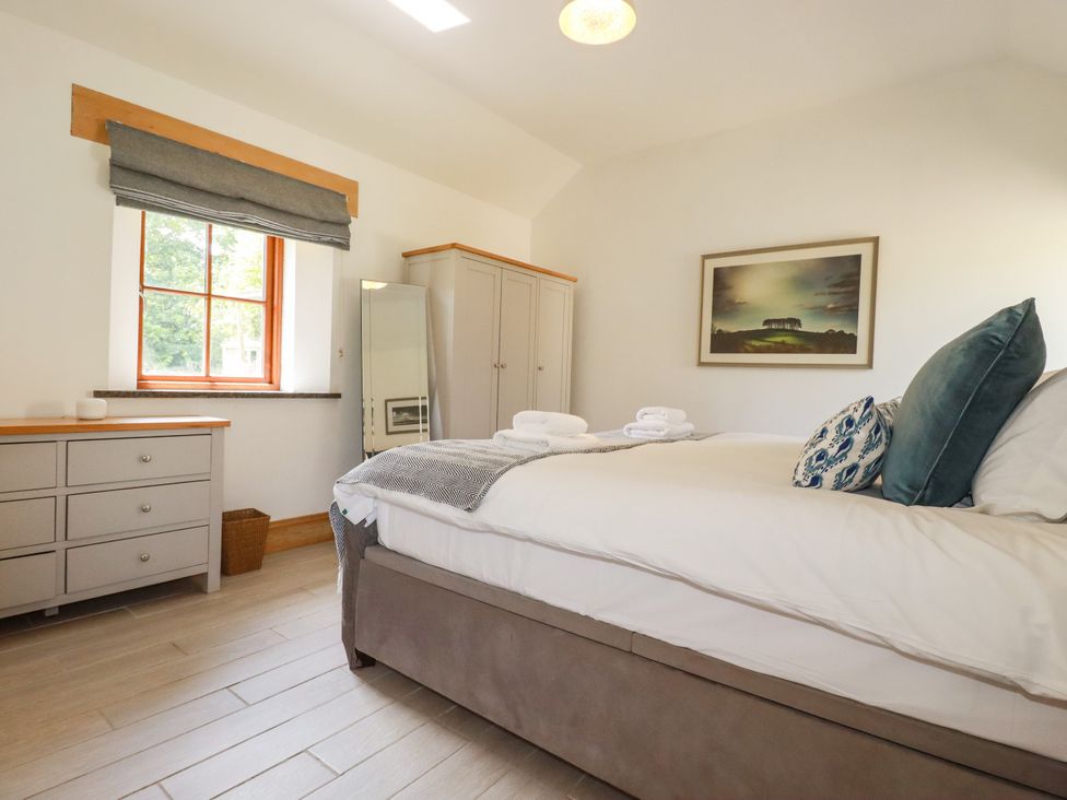 A bedroom with a bed and drawer unit at Little Trethellan in Trethellan near Lanner
