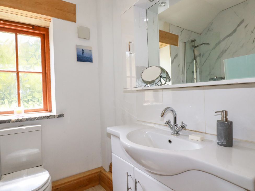 A bathroom with a sink and toilet at Little Trethellan Trethellan near Lanner