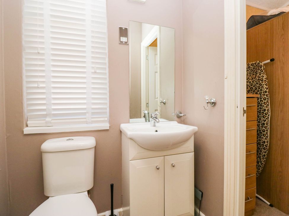 A bathroom with a toilet and sink at South Lakeland Lodge No. 46 Gressingham near Carnforth