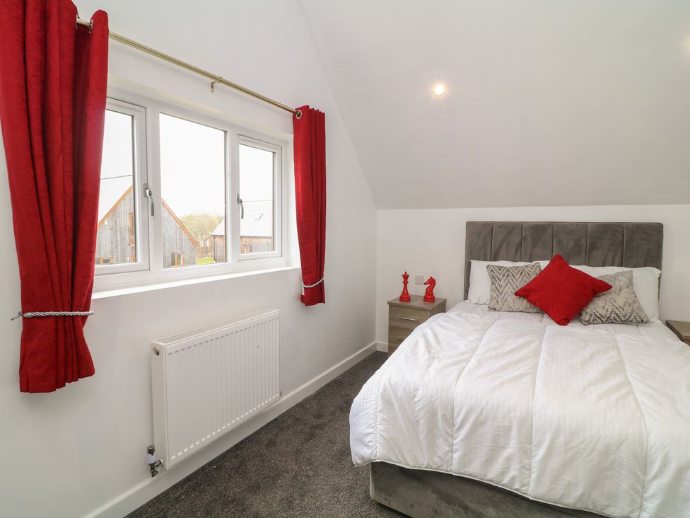A bedroom with a bed and window at Ruby Red in Brigg