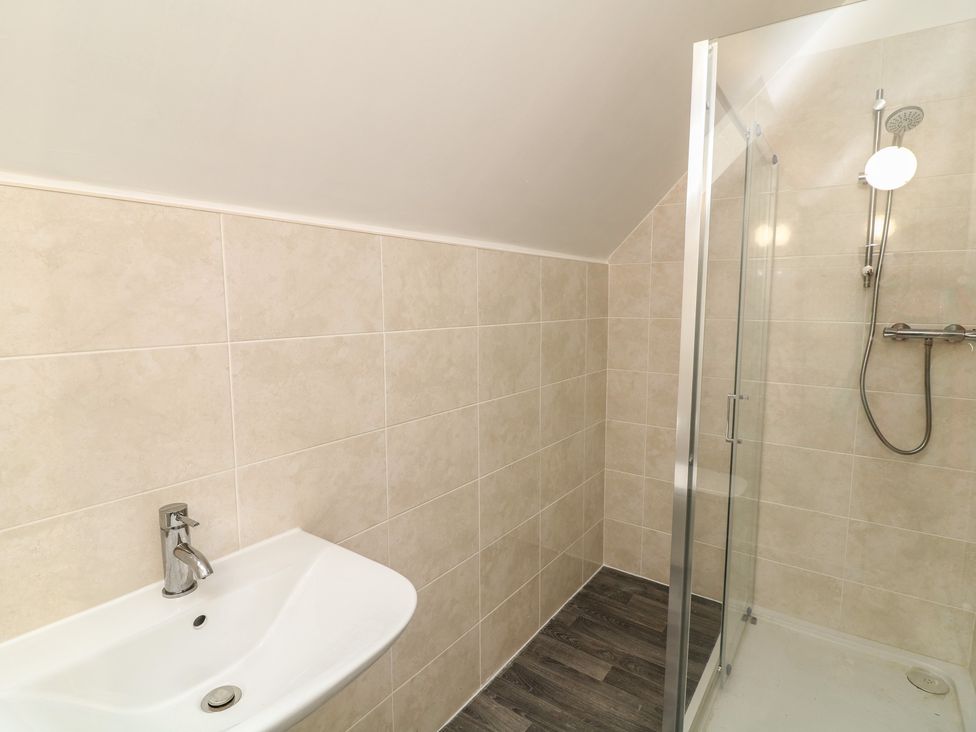 A bathroom with a sink and shower at Ruby Red in Brigg