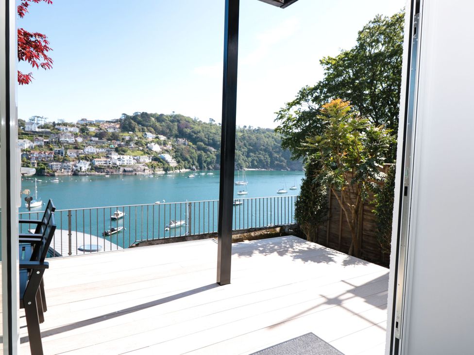 A balcony view of water and boats at Galvayne in Dartmouth