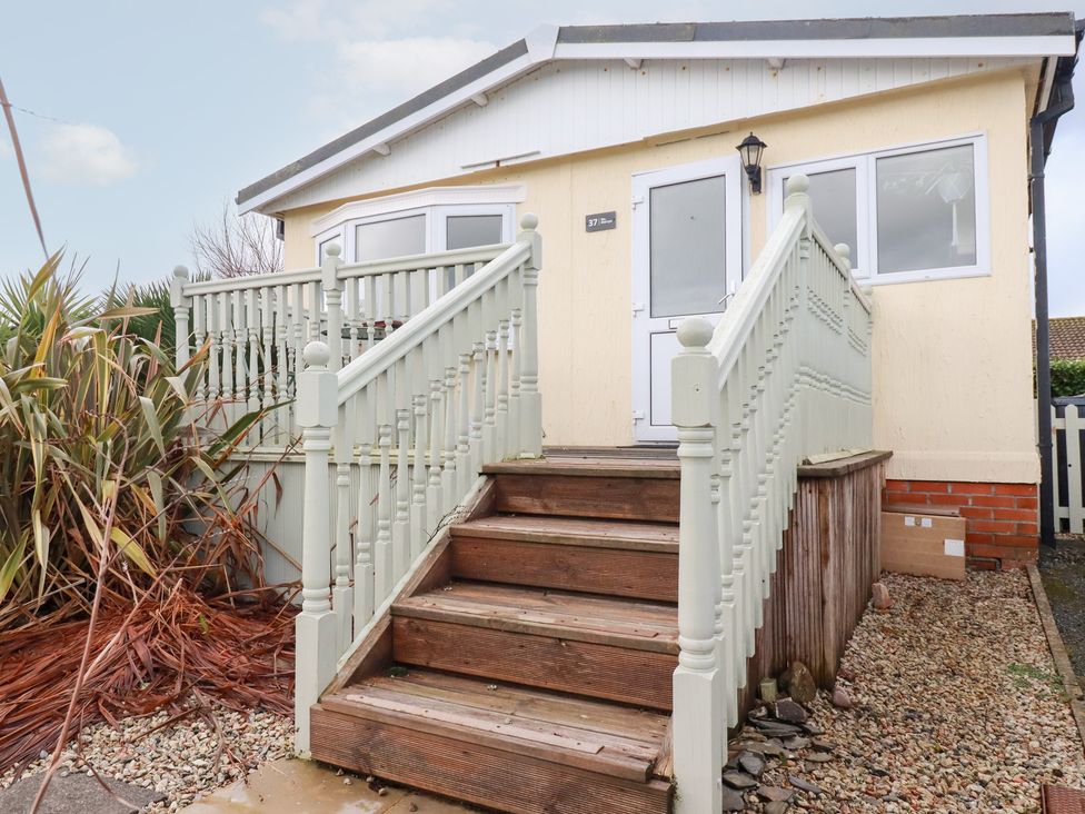 A house entrance with steps and railing at Ms Merryn 37 St. Cadocs