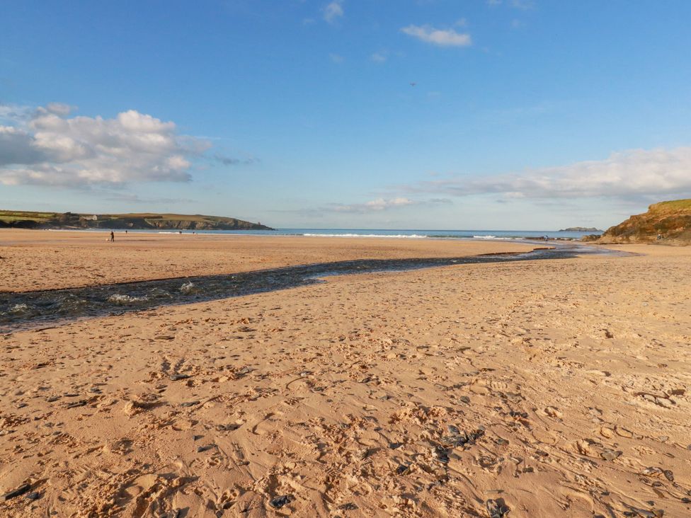 A beach with sand and ocean waves at Ms Merryn 37 St. Cadocs Tregolds near St Merryn