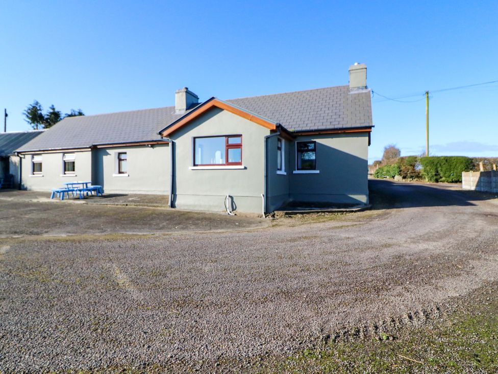 A house with a driveway and table at Thadg and Hannah’s in Miltown