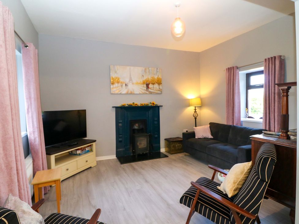 A living room with a sofa and television at Thadg and Hannah’s in Miltown