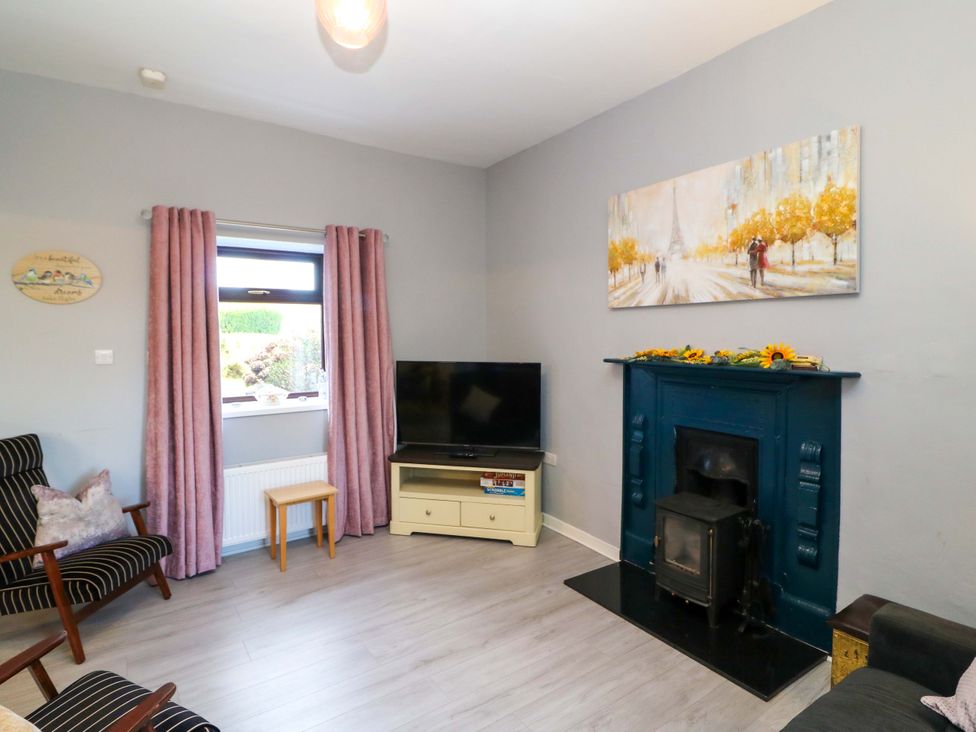 A living room with a television and fireplace at Thadg and Hannah’s in Miltown