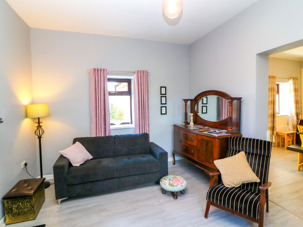 A living room with a sofa and armchair at Thadg and Hannah’s in Miltown