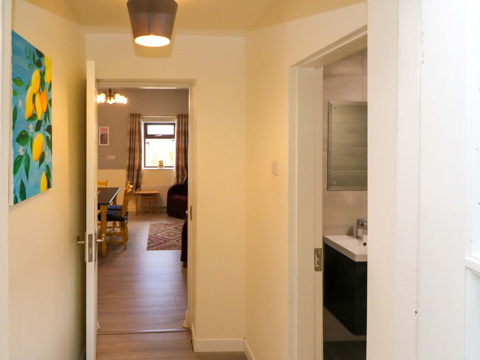 A hallway with a painting on the wall at Thadg and Hannah’s in Miltown